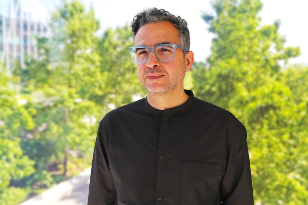 man wearing black shirt and gray glasses