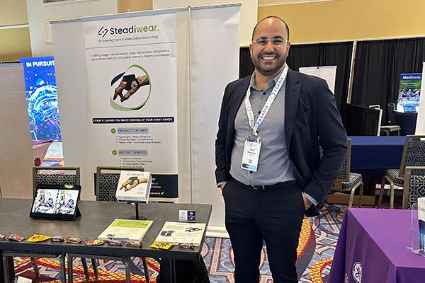 Man standing in front of table at event