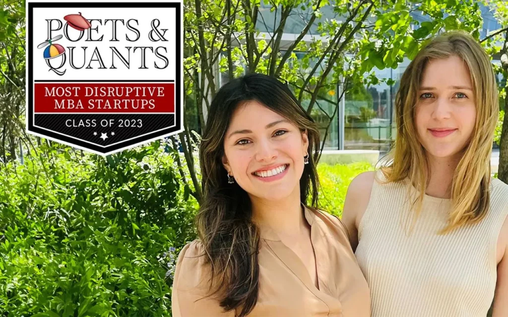 Two woman standing wearing tan blouses standing outside with greenery background. Poets & Quants logo in upper left corner of photo.