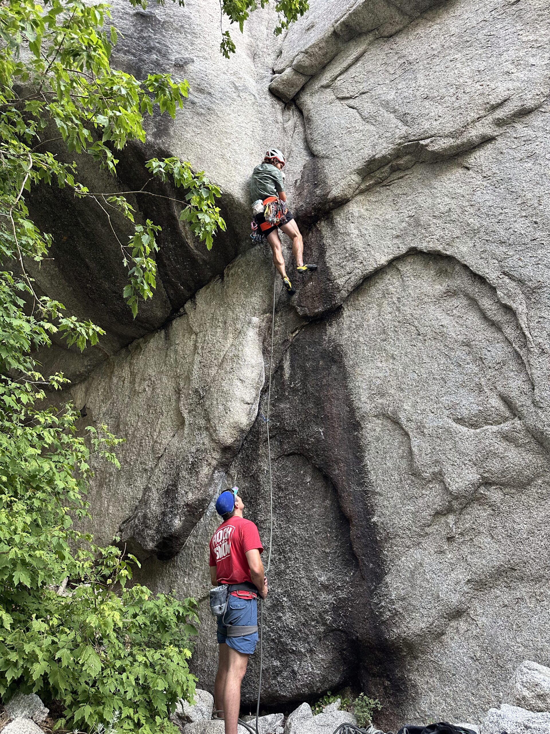 Marcos Karakousis rock climbing with coworkers in Utah.