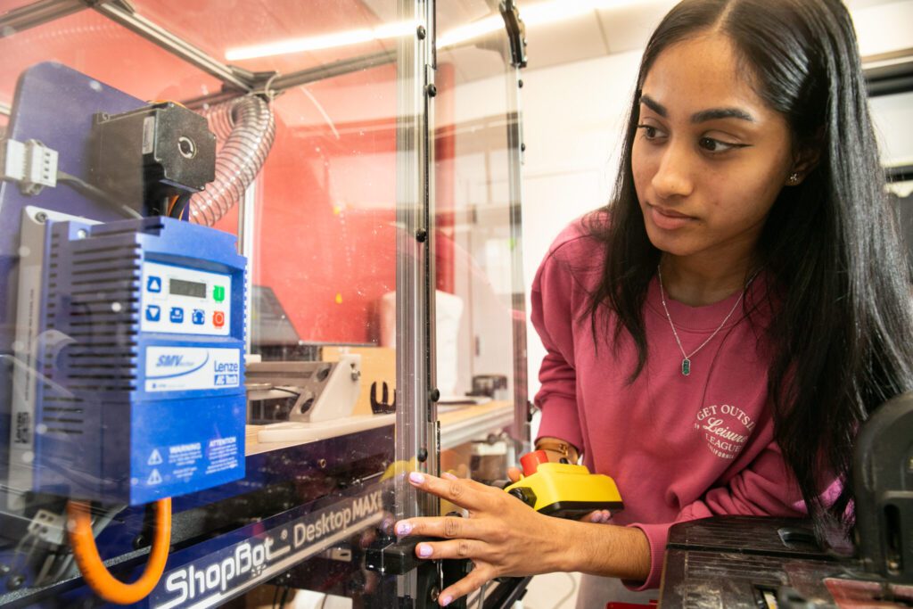 student working in the Wood Shop in the MakerLAB