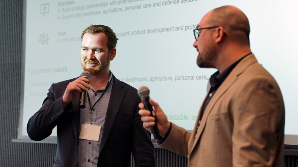 Two men holding microphones
