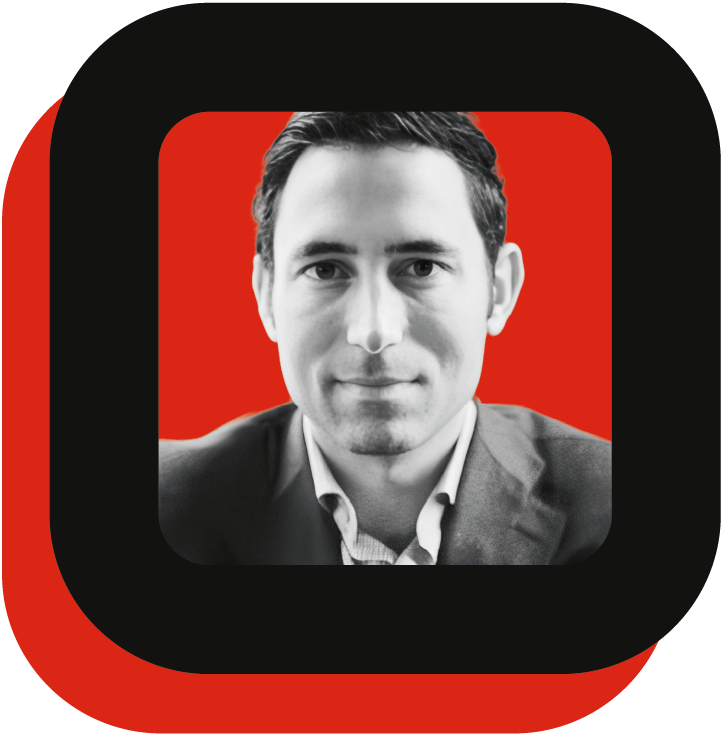 Black and white photo of a man with a red and black squared frame.