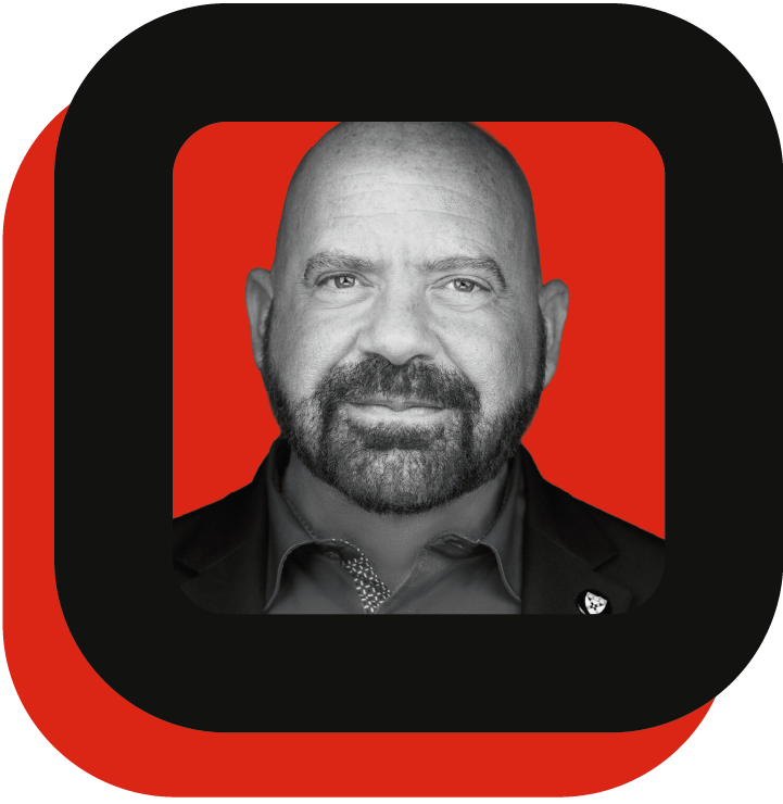 Black and white photo of a man with a red and black square frame.