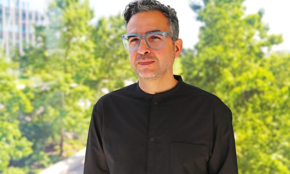 man wearing black shirt and gray glasses