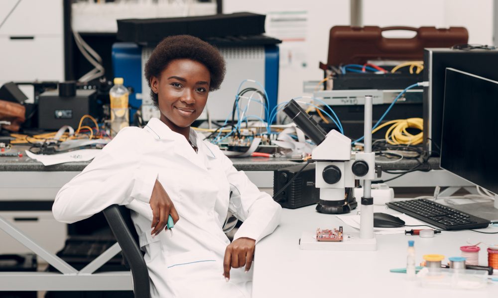 Scientist african american woman working in laboratory with electronic instruments