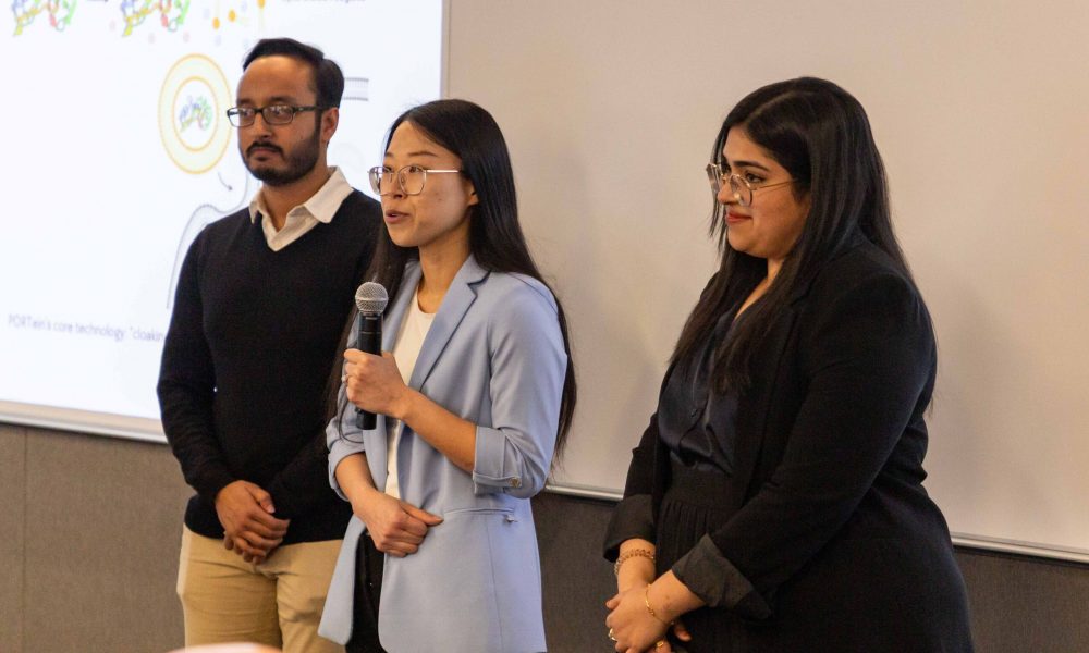 Ava Hoog, MBA ’25 pitches alongside partners Samyuktha Ravi, MBA ’25, and Azmain Alamgir, PhD candidate (College of Engineering) to a crowd at the Life Science Technology Innovation Fellowship showcase in NYC.