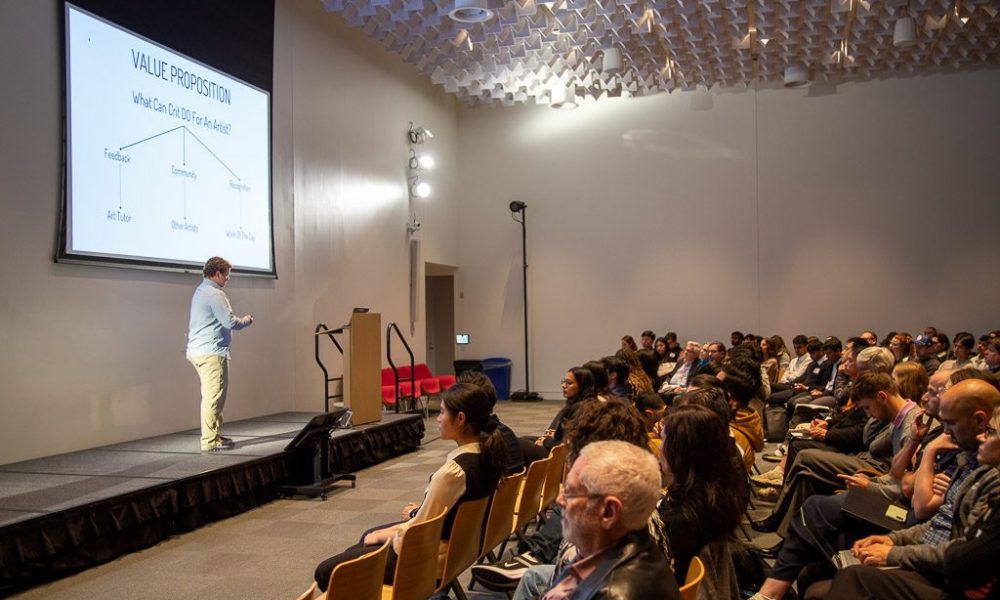 Damon Hollenbeck ‘25, founder of CRIT, a platform that provides technical feedback for artists speaks to a crowd at the 2024 Cornell Entrepreneurship Showcase: Student Pitches and Venture Panel.