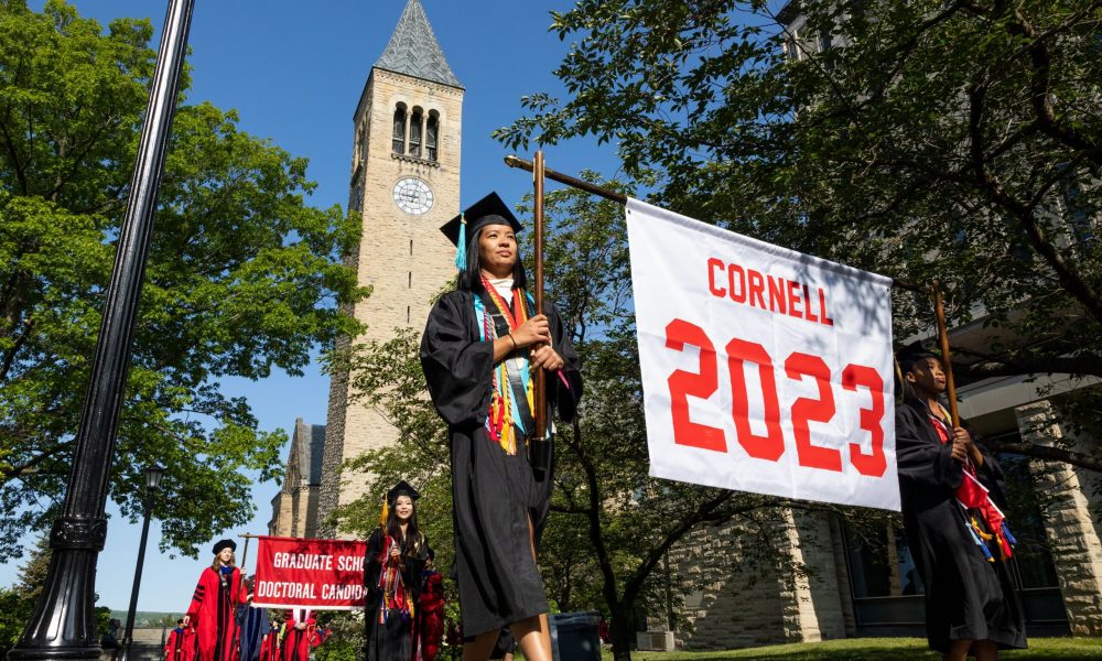 Graduating students in 2023 procession line on Cornell campus