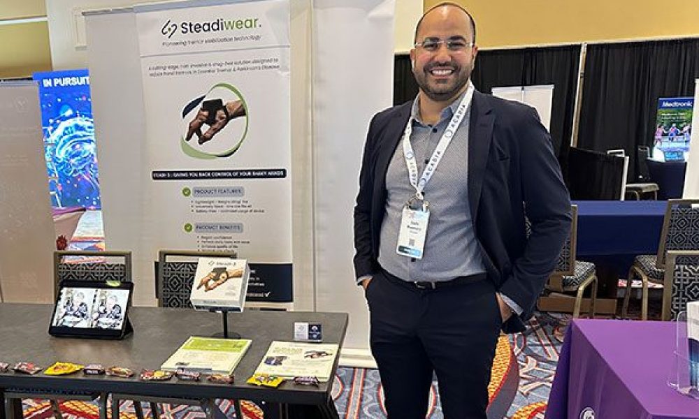 Man standing in front of table at event