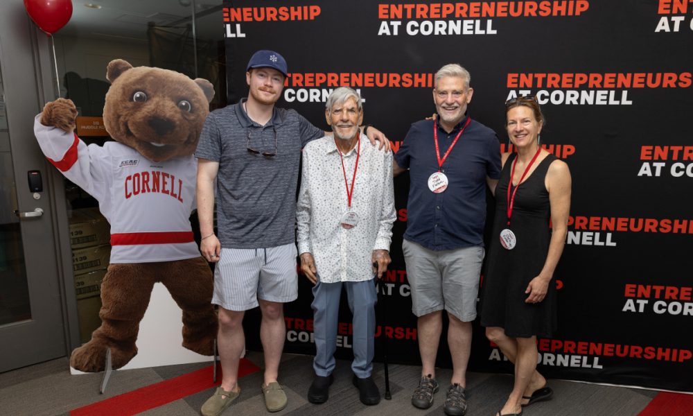 Family standing with bear cut out