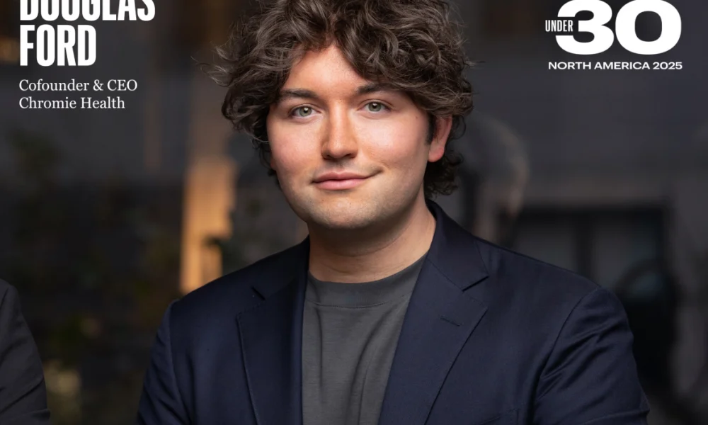 man in suit jacket and curly hair