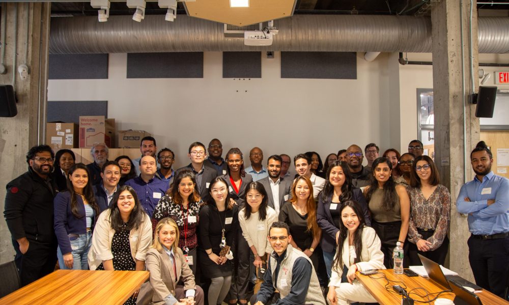 Jssa Cohort poses for a group photo in Buisness casual attire