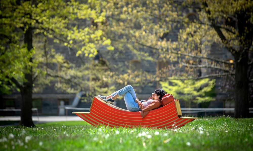 person lounging on hammock