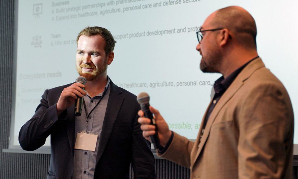Two men holding microphones