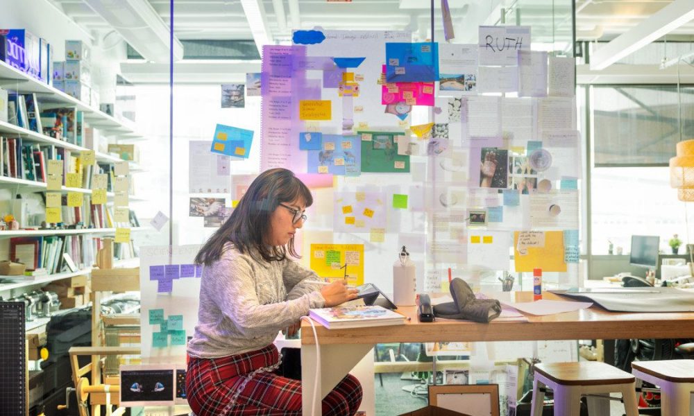 woman working in a colorful office