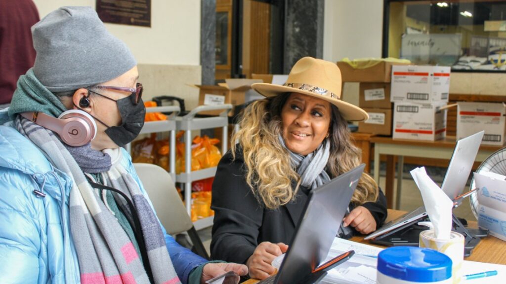 people wearing hats at food pantry in NYC
