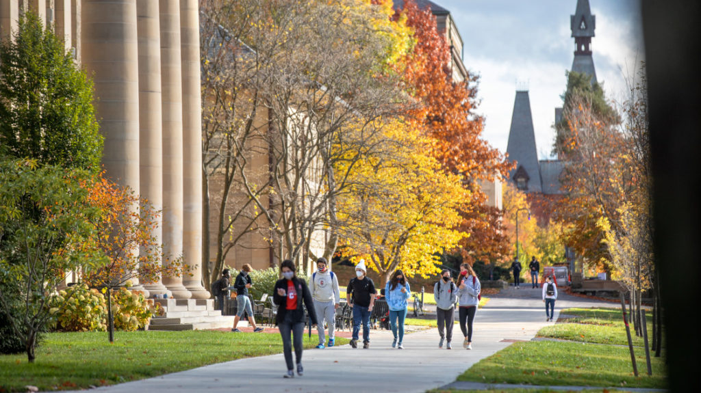 students walking in front of Goldwin Smith Hall