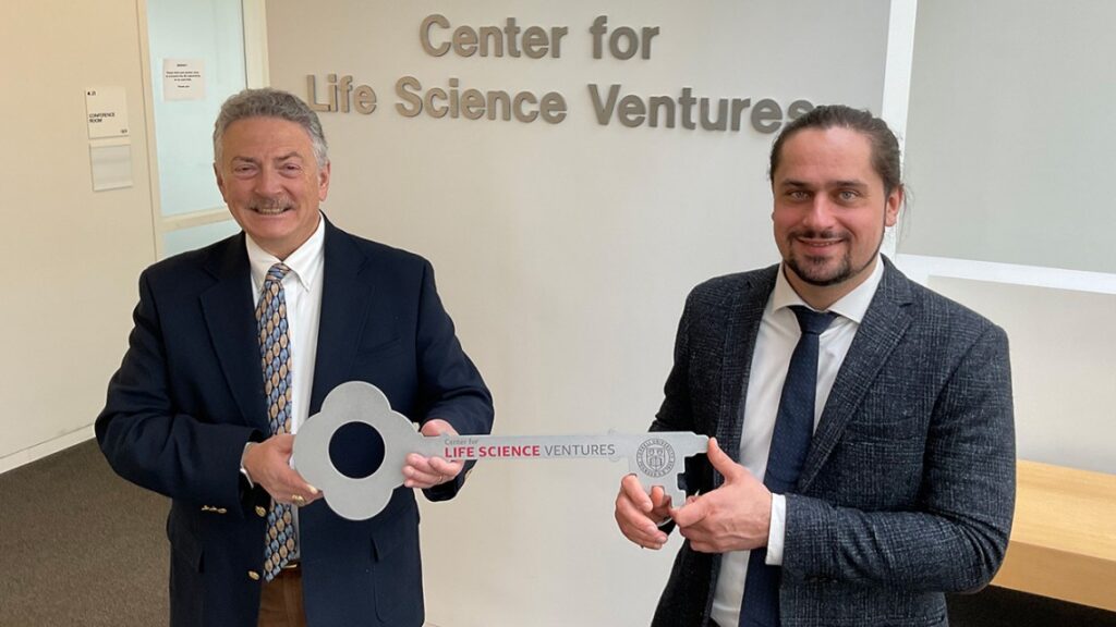 two people holding life sciences venture key