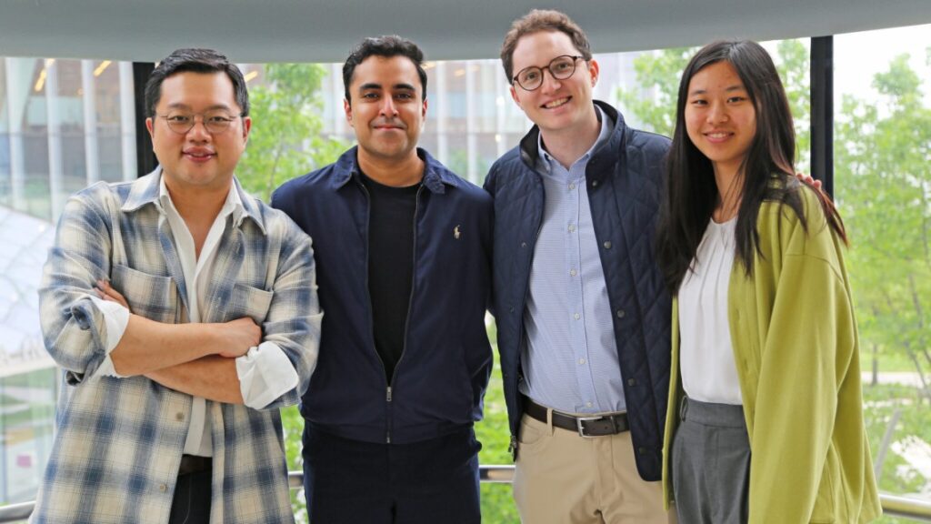 Group of four people standing together